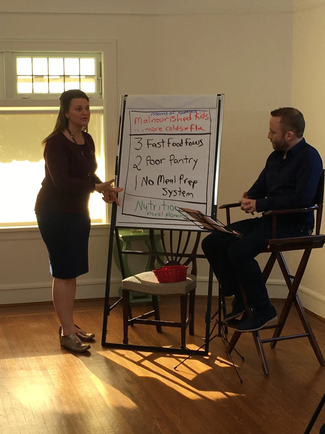 Callan and Justin teaching together at a flipchart