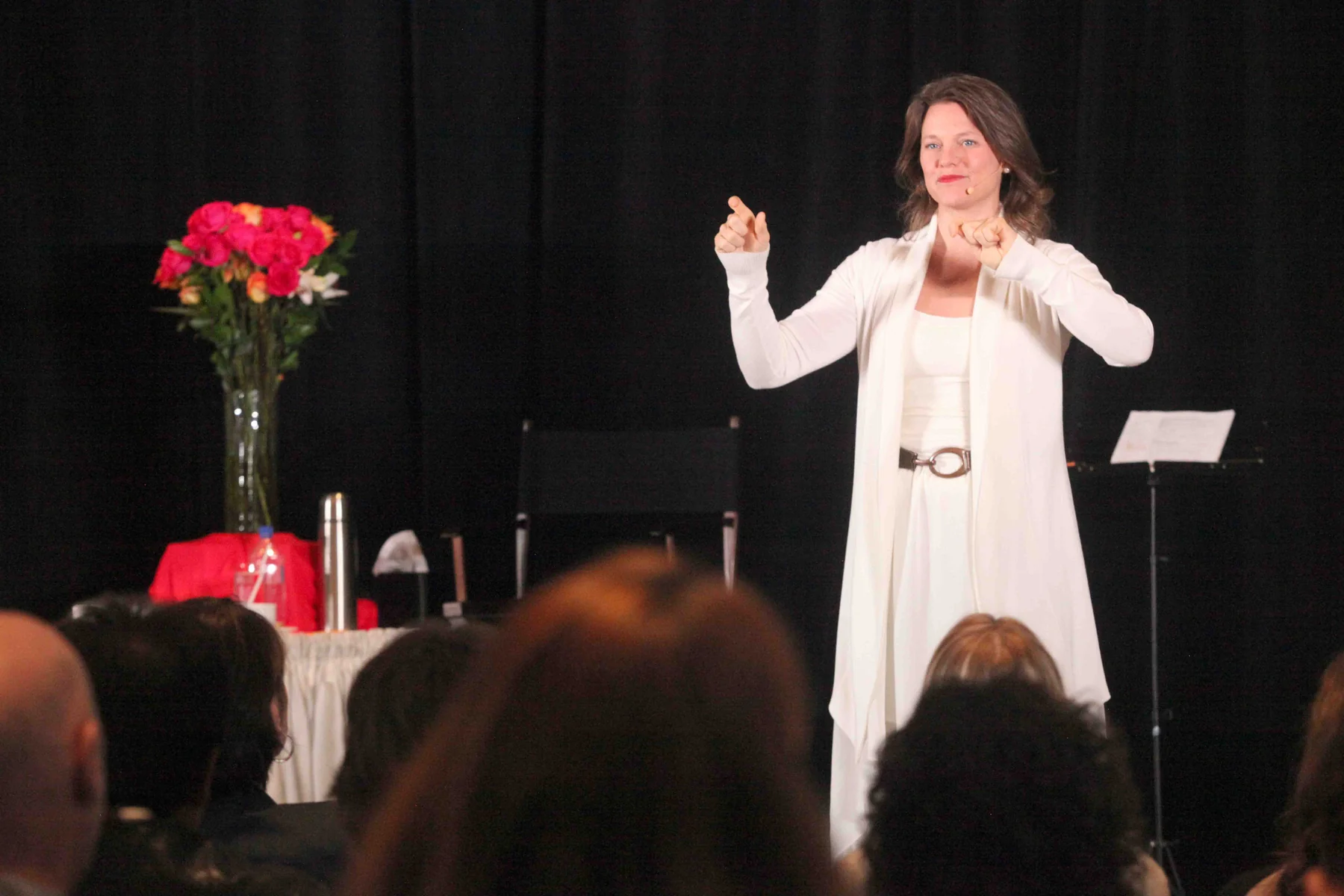 Callan teaching on stage in front of a full room
